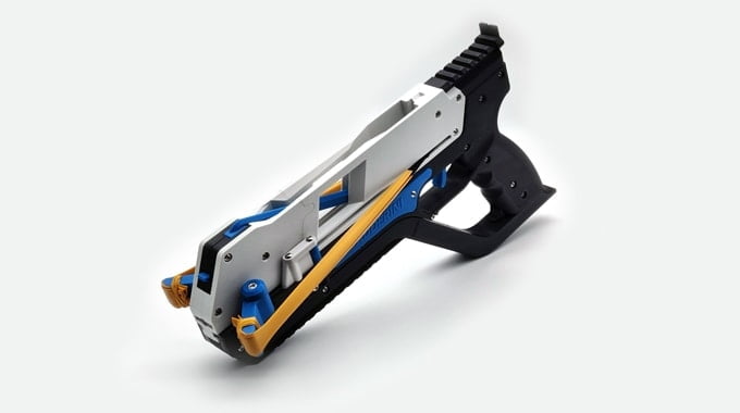 A blue and yellow staple gun on a white surface